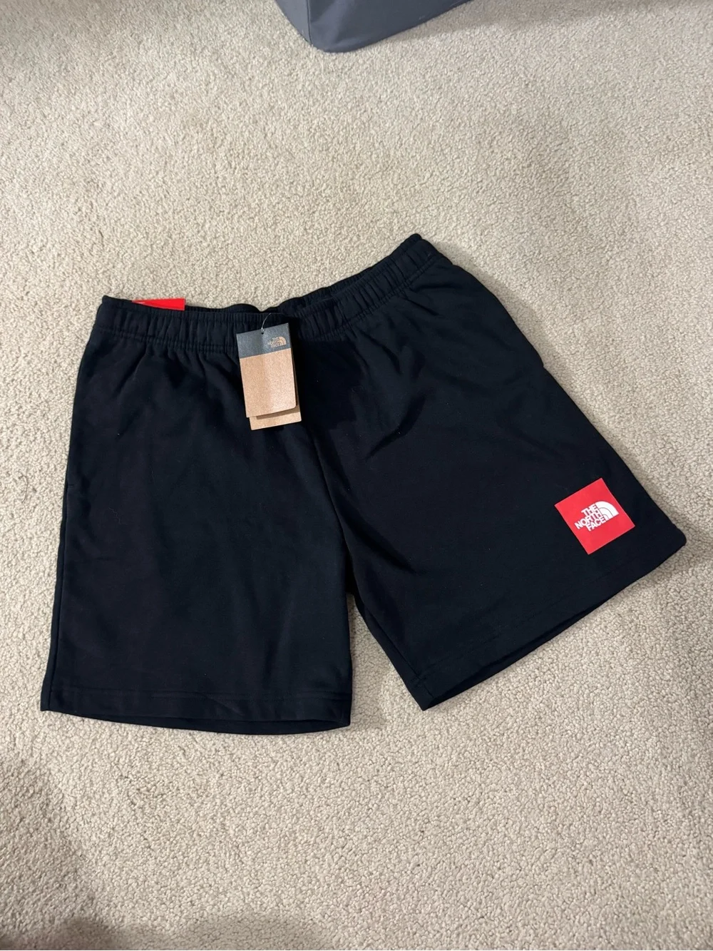 The North Face Men's Black Athletic Shorts with Red Logo Patch